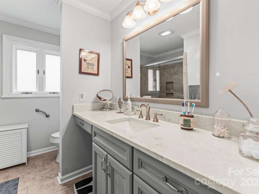 128 Killian Farm Road, Stanley, NC 28164.  MLS# CAR4288617, YatesRealty ID 30393. Custom vanity with dressing area and quartz counter tops