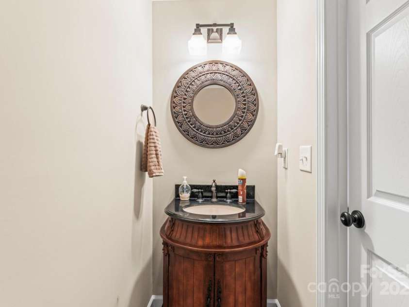 128 Killian Farm Road, Stanley, NC 28164.  MLS# CAR4288617, YatesRealty ID 30393. Furniture vanity in the half bath