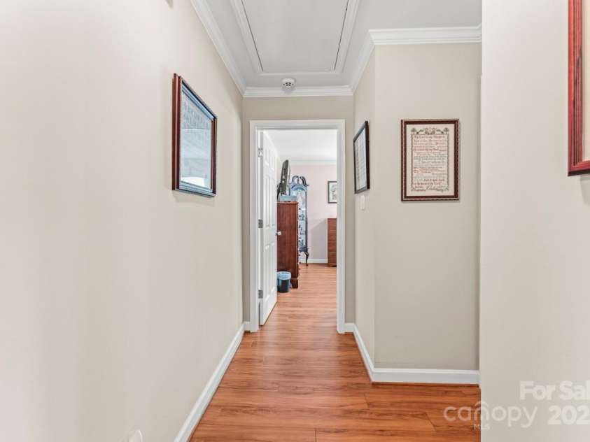 128 Killian Farm Road, Stanley, NC 28164.  MLS# CAR4288617, YatesRealty ID 30393. Hallway leading to the full bath and bedroom