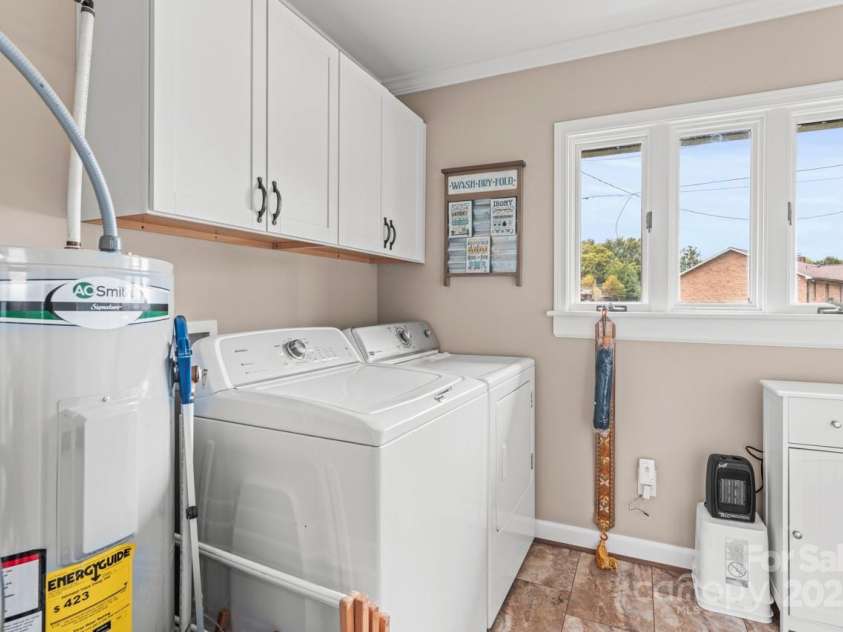 128 Killian Farm Road, Stanley, NC 28164.  MLS# CAR4288617, YatesRealty ID 30393. Laundry room with added cabinets