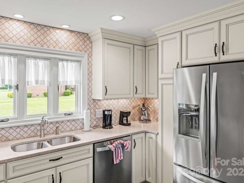 128 Killian Farm Road, Stanley, NC 28164.  MLS# CAR4288617, YatesRealty ID 30393. SS appliances including ceramic cooktop, wall oven and microwave.  All appliances convey