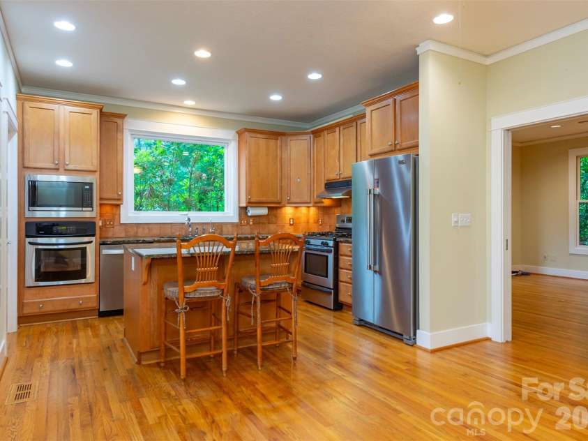 204 Briarcliff None, Asheville, NC 28804.  MLS# CAR4356958, YatesRealty ID 30393. The living room flows seamlessly into the kitchen