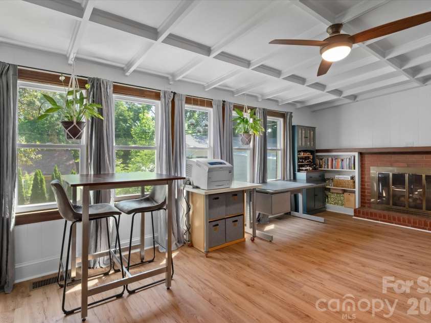354 Bost Street, Statesville, NC 28677.  MLS# CAR4344460, YatesRealty ID 30407. Sunroom with fireplace and ceiling with beautiful architectural details.