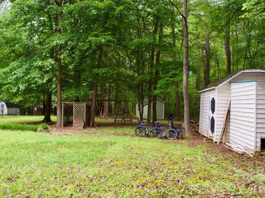 908 Buddys Choice Road, York, SC 29745.  MLS# CAR4381686, YatesRealty ID 30413. Back yard, storage buildings two - four