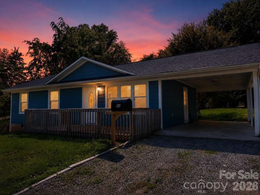 84 Hunt Drive, Nebo, NC 28761.  MLS# CAR4387996, YatesRealty ID 30420. AI twilight effect