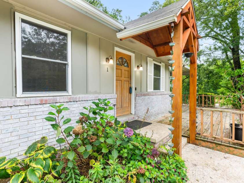 1 Eastcrest Drive, Fairview, NC 28730.  MLS# CAR4281826, YatesRealty ID 30421. A beautiful portico welcomes you home