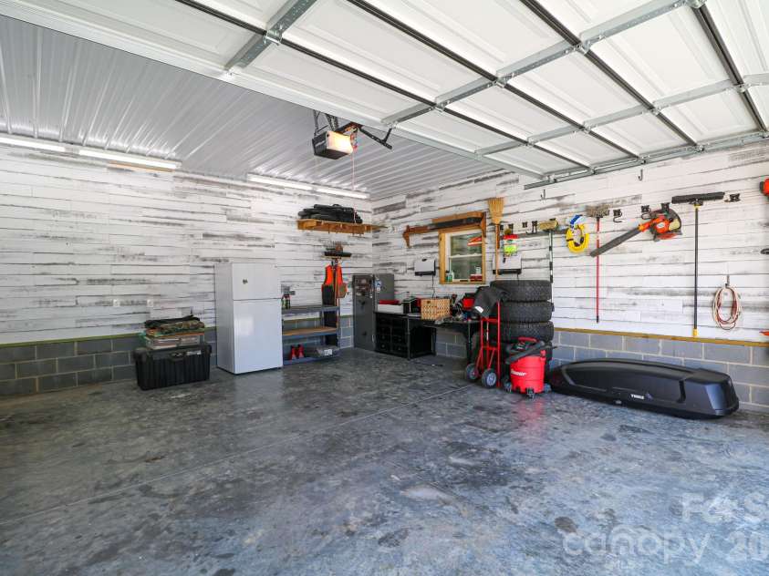 120 Wellington Drive, Salisbury, NC 28144.  MLS# CAR4393362, YatesRealty ID 30442. Inside workshop with remote garage door.