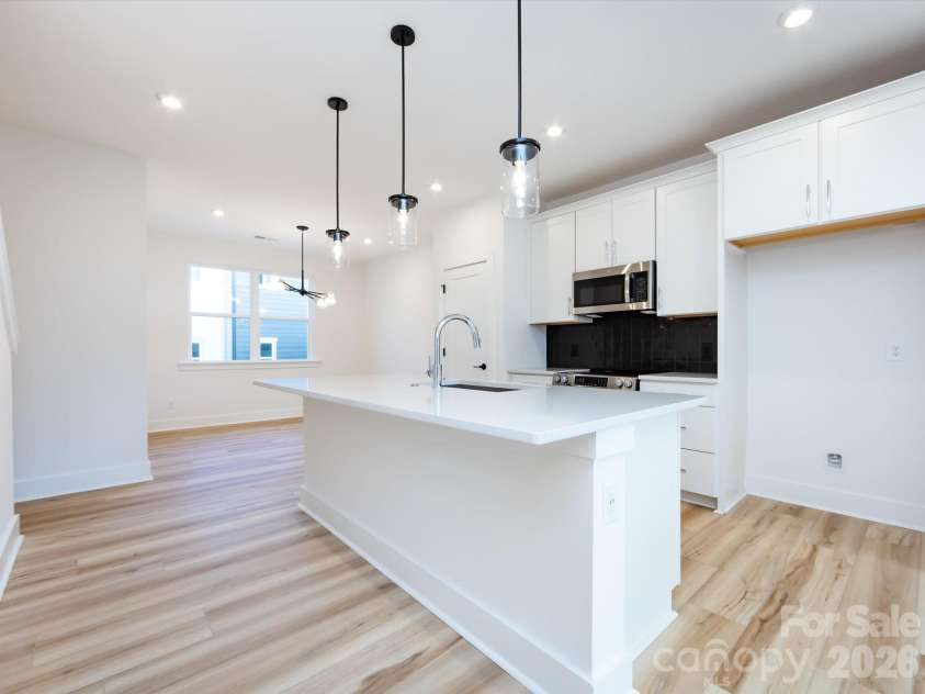 7022 Impulse Court, Charlotte, NC 28205.  MLS# CAR4349977, YatesRealty ID 30446. Chef inspired kitchen with clean white cabinets