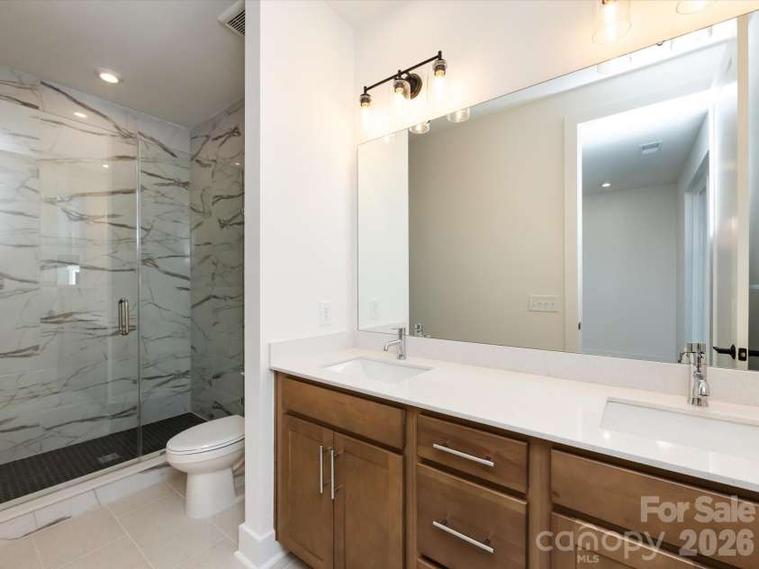 7022 Impulse Court, Charlotte, NC 28205.  MLS# CAR4349977, YatesRealty ID 30446. Dual Vanity Primary Bathroom