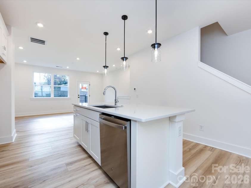 7022 Impulse Court, Charlotte, NC 28205.  MLS# CAR4349977, YatesRealty ID 30446. Kitchen featuring large kitchen island