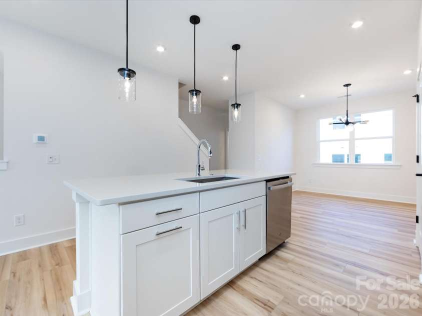 7022 Impulse Court, Charlotte, NC 28205.  MLS# CAR4349977, YatesRealty ID 30446. Kitchen featuring large kitchen island