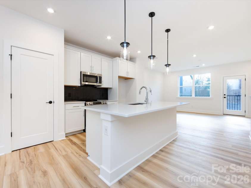 7022 Impulse Court, Charlotte, NC 28205.  MLS# CAR4349977, YatesRealty ID 30446. Kitchen with Pantry