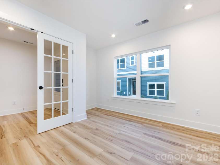 7022 Impulse Court, Charlotte, NC 28205.  MLS# CAR4349977, YatesRealty ID 30446. Light filled First Floor Flex Space
