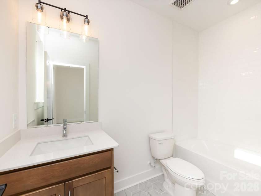 7022 Impulse Court, Charlotte, NC 28205.  MLS# CAR4349977, YatesRealty ID 30446. Secondary Bathroom