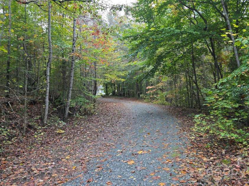 663 Landrum Road, Columbus, NC 28722.  MLS# CAR4315052, YatesRealty ID 30450. Driveway facing house