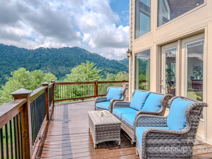 27 Country Beech Lane, Burnsville, NC 28714.  MLS# CAR4288106, YatesRealty ID 30453. Approx 700 sq ft of deck and covered porch areas