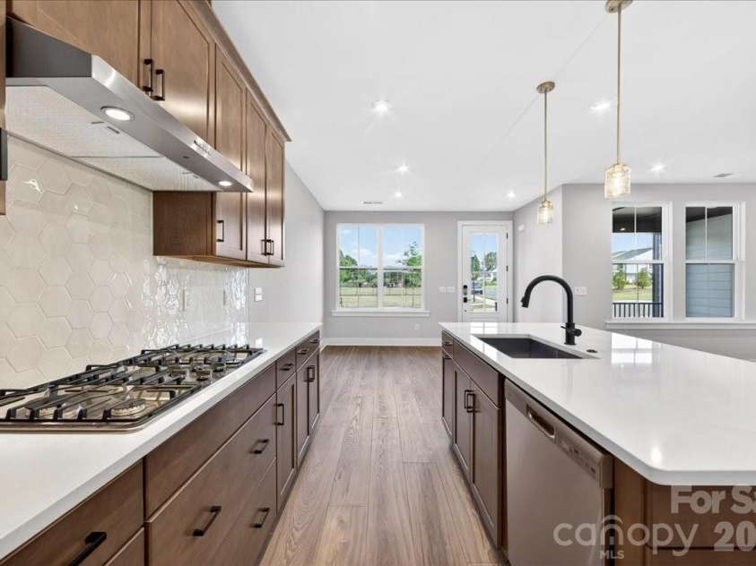 79 Seven Oaks Landing, Belmont, NC 28012.  MLS# CAR4387496, YatesRealty ID 30455. Light filled kitchen