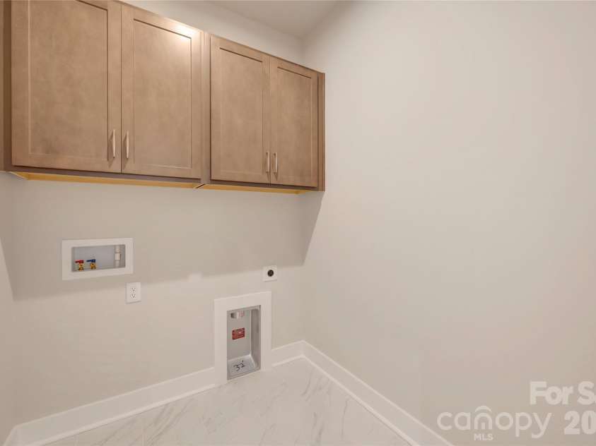 316 Ardmore Drive, Belmont, NC 28012.  MLS# CAR4387503, YatesRealty ID 30456. Laundry room with upper cabinets