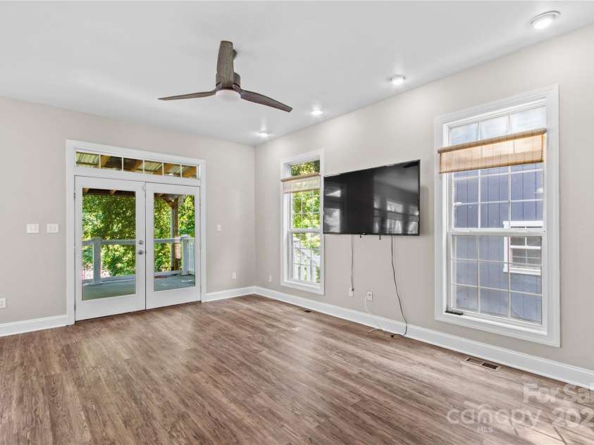 315 Wood Duck Loop, Mooresville, NC 28117.  MLS# CAR4268002, YatesRealty ID 30458. 315 Wood Duck Loop, Mooresville NC MLS 4268002 Waterfront. Great room with French doors to the back deck.