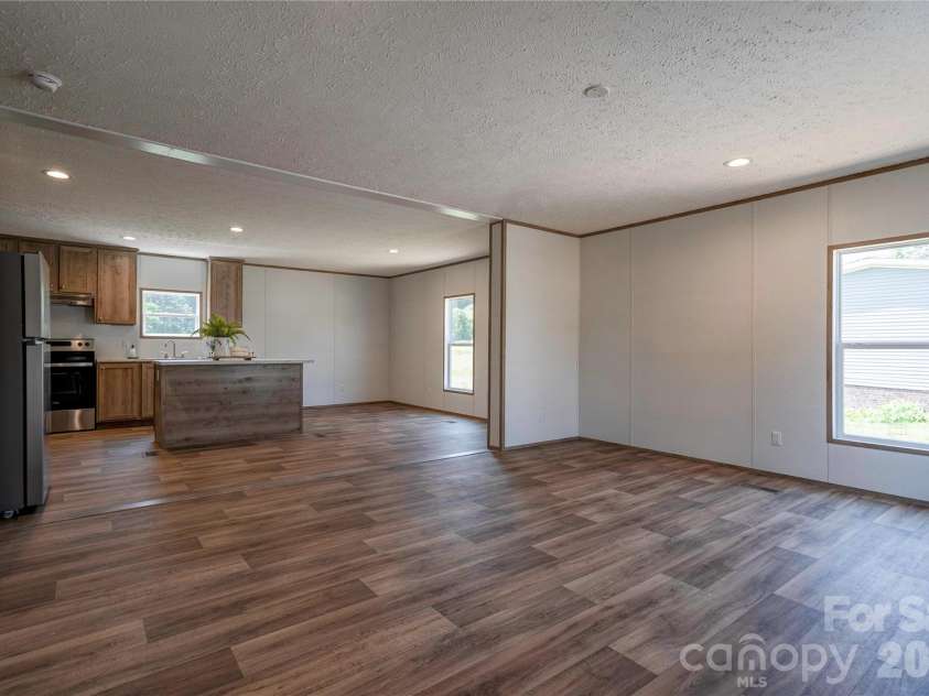 106 Advent Drive, Grover, NC 28073.  MLS# CAR4389271, YatesRealty ID 30459. Living Room, Dining & Kitchen