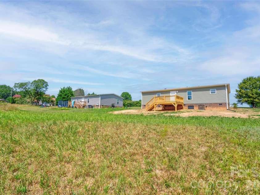 106 Advent Drive, Grover, NC 28073.  MLS# CAR4389271, YatesRealty ID 30459. Rear & Left Side