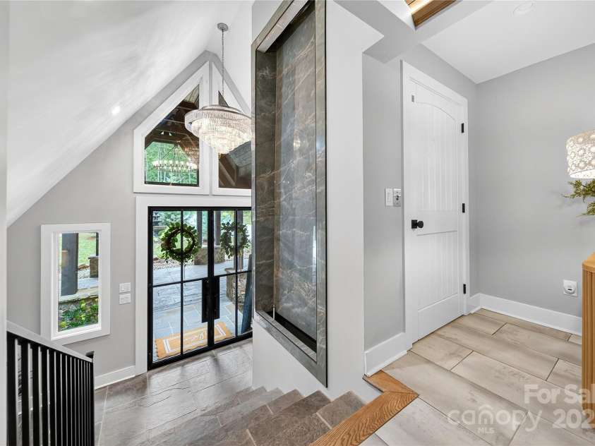 7508 Bankhead Road, Denver, NC 28037.  MLS# CAR4287314, YatesRealty ID 30460. Stone floor foyer with waterfall and elevator