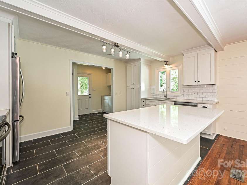 3849 Bon Rea Drive, Charlotte, NC 28226.  MLS# CAR4287106, YatesRealty ID 30466. Kitchen window overlooks large back yard with mature trees.