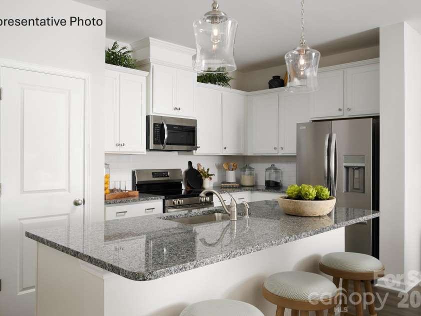 6561 Fire Lily Lane, Charlotte, NC 28216.  MLS# CAR4381611, YatesRealty ID 30467. Kitchen with Large Island