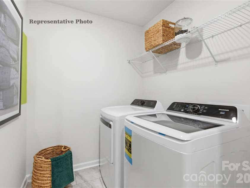 6561 Fire Lily Lane, Charlotte, NC 28216.  MLS# CAR4381611, YatesRealty ID 30467. Large Laundry Room with Linen Closet