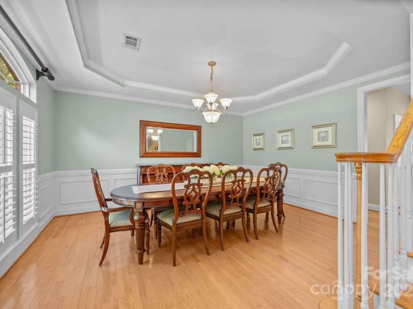 6703 Garden Hill Drive, Huntersville, NC 28078.  MLS# CAR4265776, YatesRealty ID 30476. Dining room with plantation shutters and crown molding detail