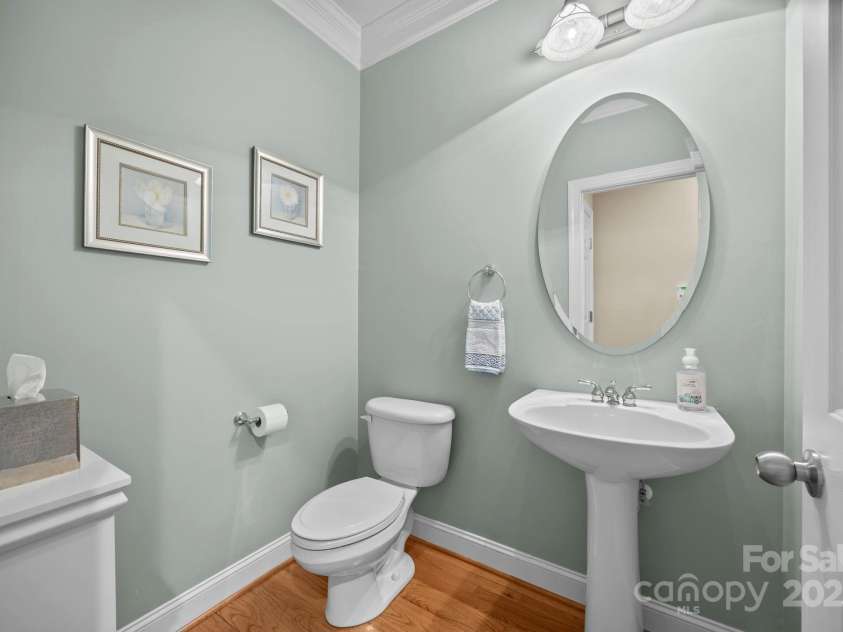 6703 Garden Hill Drive, Huntersville, NC 28078.  MLS# CAR4265776, YatesRealty ID 30476. Half bath with crown molding detail off the kitchen hallway