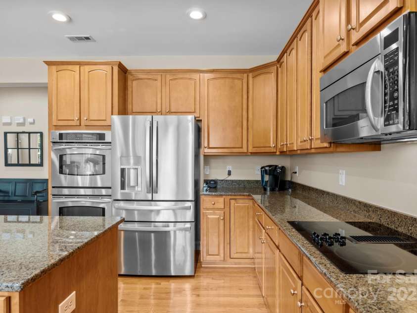 6703 Garden Hill Drive, Huntersville, NC 28078.  MLS# CAR4265776, YatesRealty ID 30476. Kitchen fridge remains