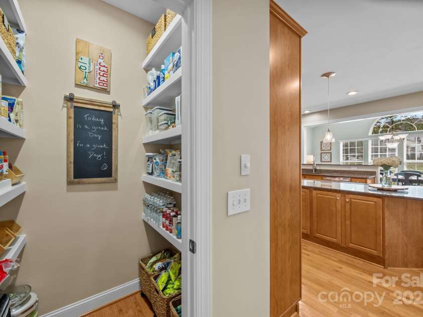 6703 Garden Hill Drive, Huntersville, NC 28078.  MLS# CAR4265776, YatesRealty ID 30476. Walk-in pantry with wood shelving