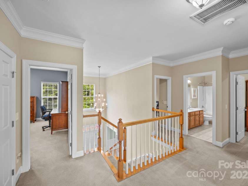 6703 Garden Hill Drive, Huntersville, NC 28078.  MLS# CAR4265776, YatesRealty ID 30476. Wide open second floor landing with crown molding detail