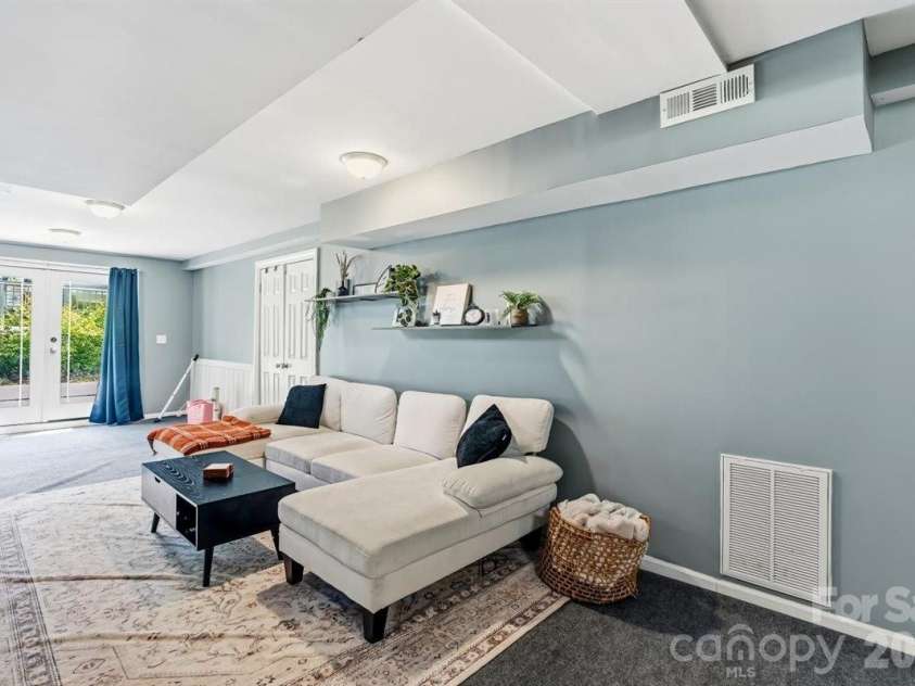 1177 Runway Drive, Hendersonville, NC 28792.  MLS# CAR4381042, YatesRealty ID 30483. Basement den