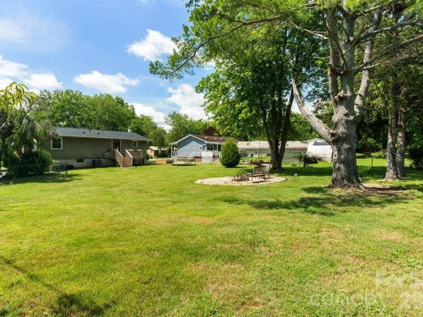 1177 Runway Drive, Hendersonville, NC 28792.  MLS# CAR4381042, YatesRealty ID 30483. Fire pit