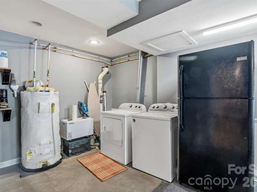 1177 Runway Drive, Hendersonville, NC 28792.  MLS# CAR4381042, YatesRealty ID 30483. Laundry area off basment den