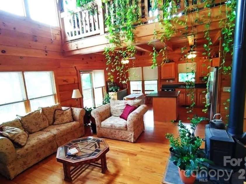 453 Grandview Peaks Drive, Nebo, NC 28761.  MLS# CAR4368502, YatesRealty ID 30490. Living towards Dining & Kitchen