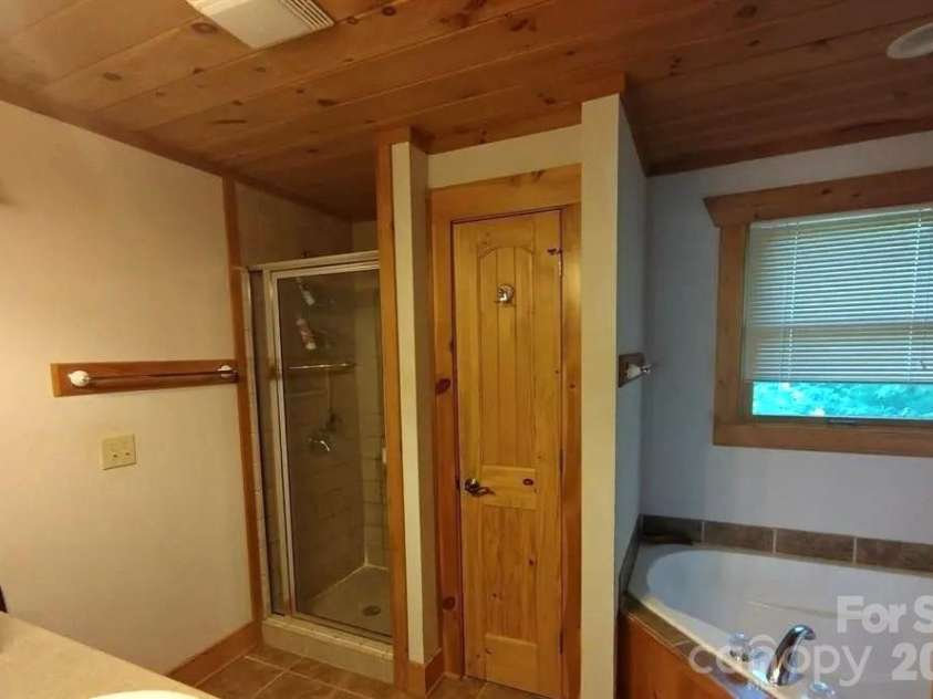 453 Grandview Peaks Drive, Nebo, NC 28761.  MLS# CAR4368502, YatesRealty ID 30490. Primary Bath Upstairs
