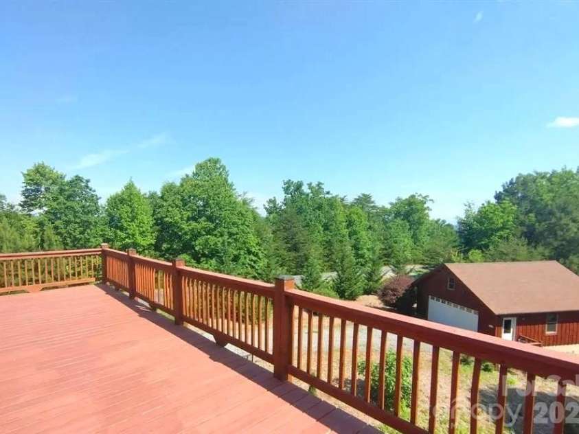 453 Grandview Peaks Drive, Nebo, NC 28761.  MLS# CAR4368502, YatesRealty ID 30490. Side Deck & Garage