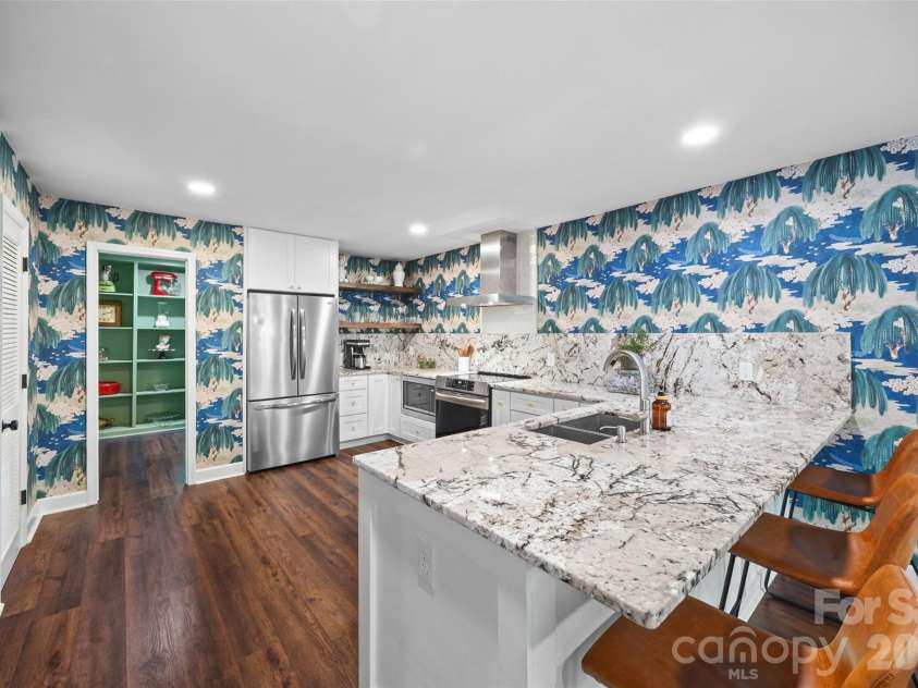 517 Raintree Drive, Matthews, NC 28104.  MLS# CAR4376465, YatesRealty ID 30492. Beautiful modern kitchen with large pantry