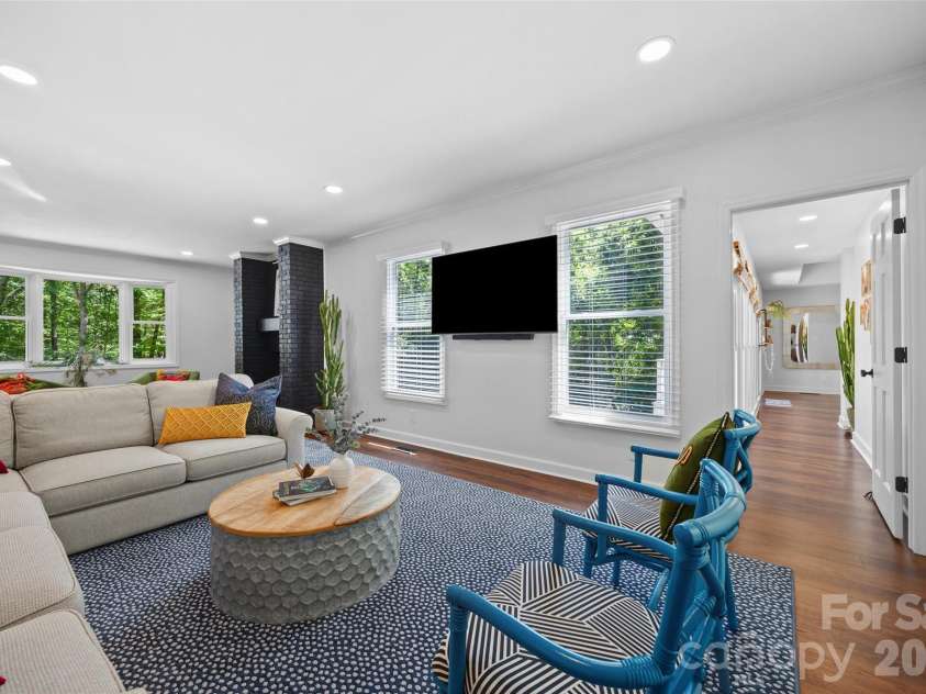 517 Raintree Drive, Matthews, NC 28104.  MLS# CAR4376465, YatesRealty ID 30492. Great room with entrance to main primary