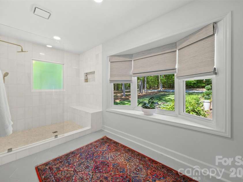 517 Raintree Drive, Matthews, NC 28104.  MLS# CAR4376465, YatesRealty ID 30492. Large primary shower