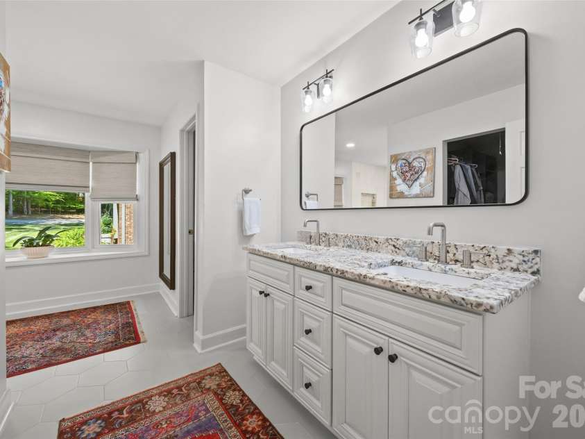 517 Raintree Drive, Matthews, NC 28104.  MLS# CAR4376465, YatesRealty ID 30492. Main level primary bathroom