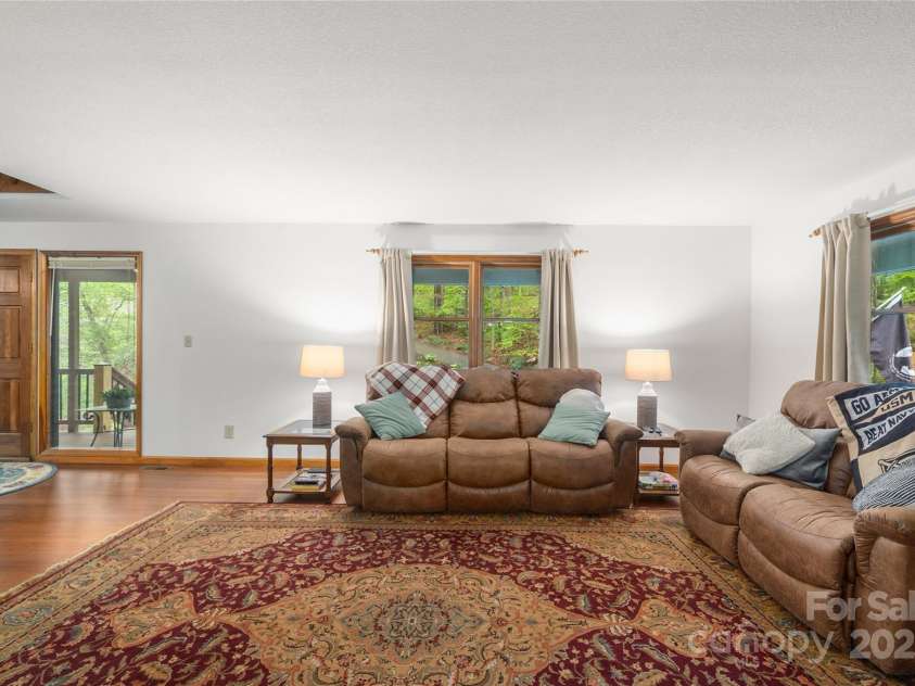 17 Morris Drive, Weaverville, NC 28787.  MLS# CAR4222234, YatesRealty ID 30498. One of the highlights of this home is the abundance of windows. Natural light floods the space all day, thanks to the windows on all sides of the house.