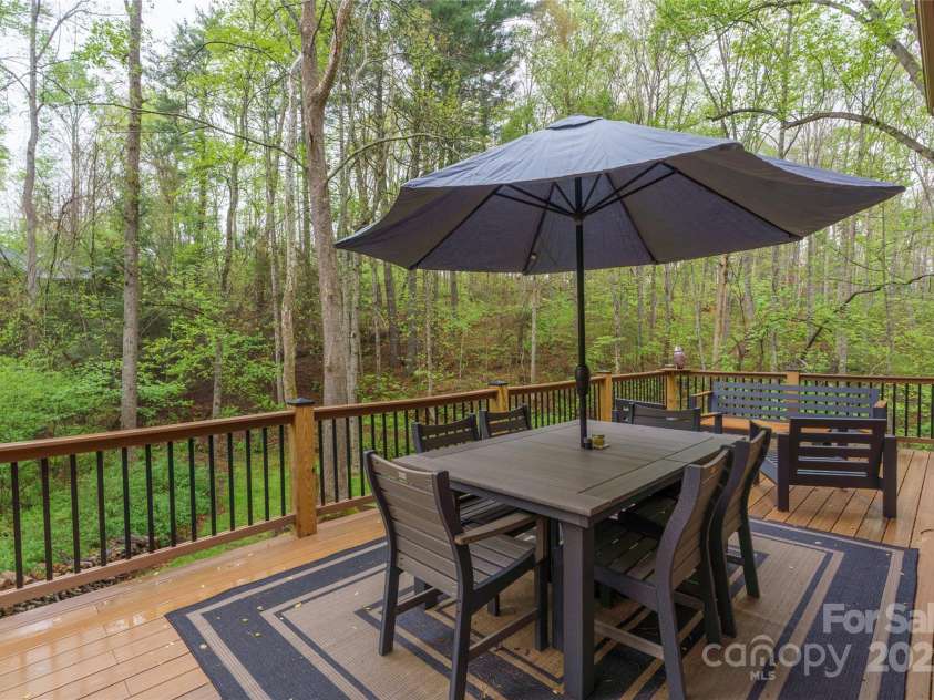 17 Morris Drive, Weaverville, NC 28787.  MLS# CAR4222234, YatesRealty ID 30498. The back deck on this property is a gem. The homeowners put a lot of work and love into making the deck a nice place to hang out. The view of the woods is great, too!