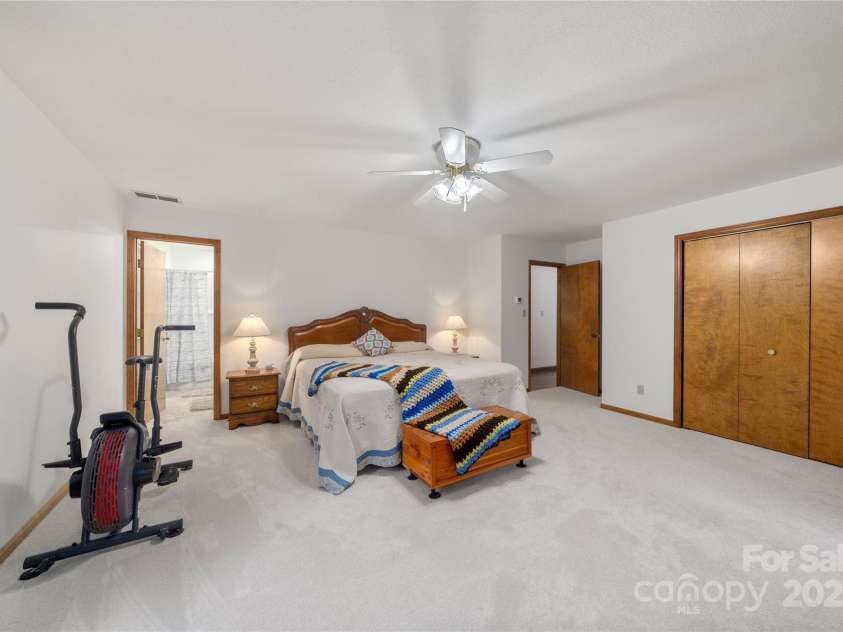 17 Morris Drive, Weaverville, NC 28787.  MLS# CAR4222234, YatesRealty ID 30498.  Very Large Primary bedroom that features an adjoining en suite bathroom with Fresh installed new carpet.