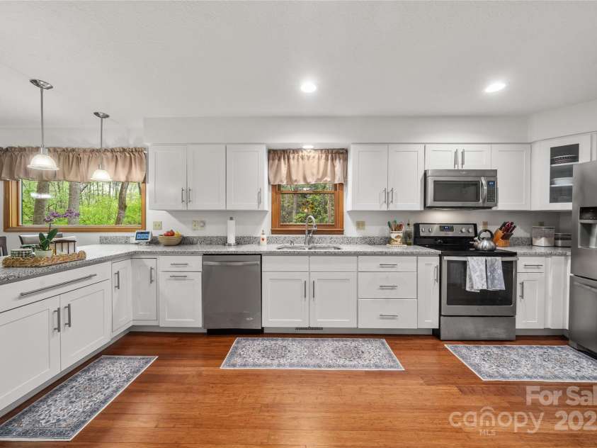 17 Morris Drive, Weaverville, NC 28787.  MLS# CAR4222234, YatesRealty ID 30498. Welcome to your stunning, newly renovated kitchen! This beautiful space features stainless steel appliances and plenty of storage to hold all your supplies. This kitchen is highlighted by white cabinets and quartz counte