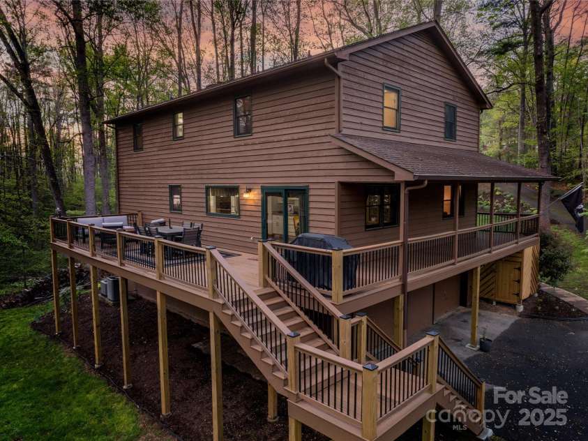17 Morris Drive, Weaverville, NC 28787.  MLS# CAR4222234, YatesRealty ID 30498. Wrap-around Deck at Twilight with Plenty of Space for Family Grilling, Relaxing, Reading a book, or Games.