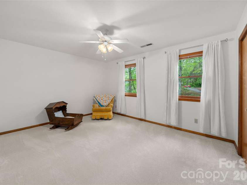 17 Morris Drive, Weaverville, NC 28787.  MLS# CAR4333064, YatesRealty ID 30498. Bedroom #2: A great spacious front bedroom with a large closet. Natural light with a wonderful space for easy placement of your bedroom furniture.  Freshly painted walls and new carpet. #2